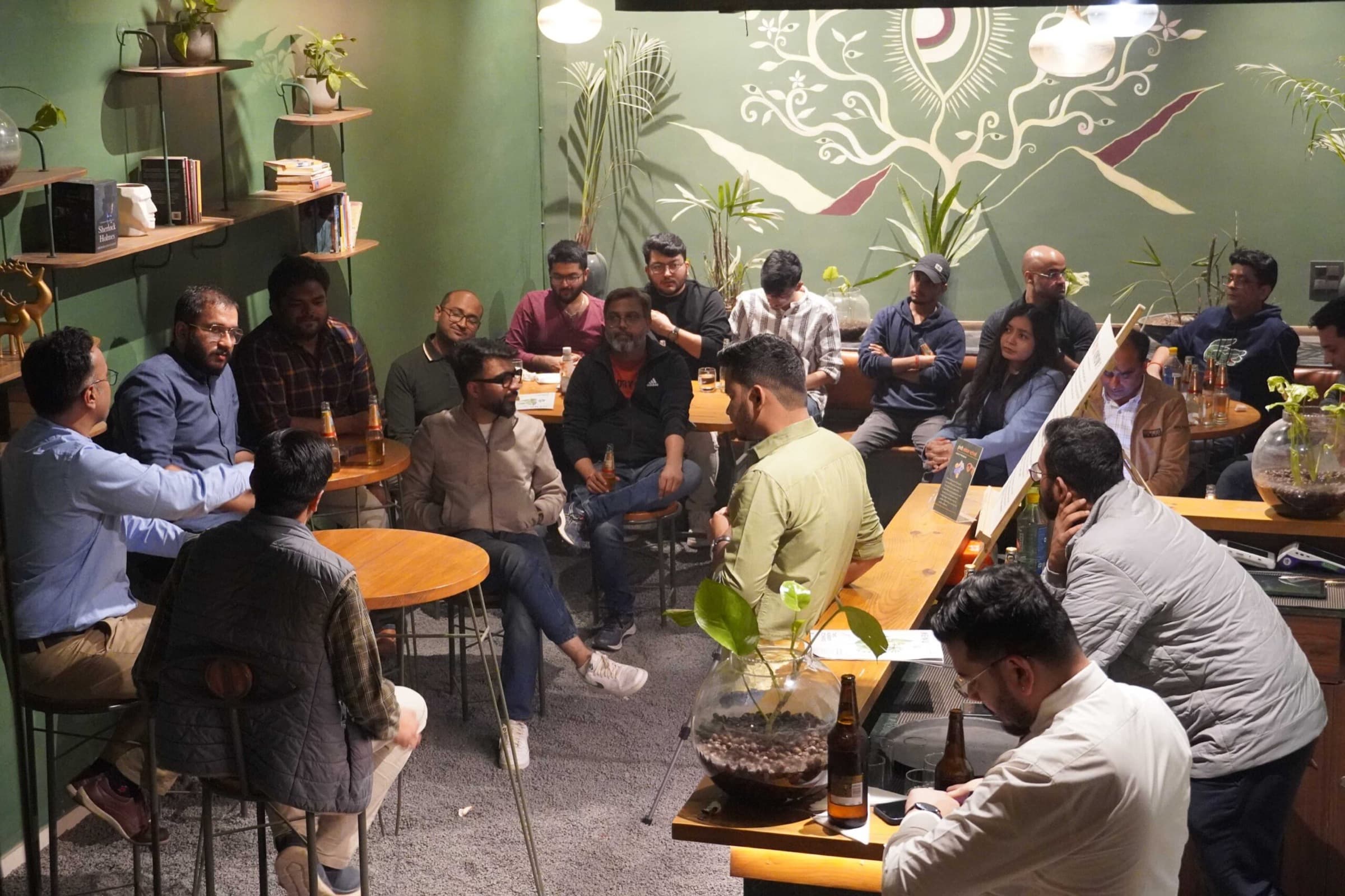 A circle of founders listening during a TrueAlpha session